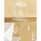 Close-up of 2-compartment acrylic dispenser: hinged lid, smooth edges, and clear construction