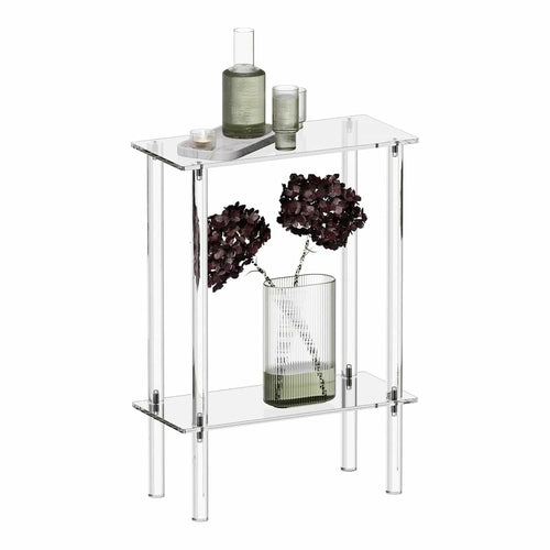 2-tier clear acrylic side table styled with a vase of dried flowers, a bottle, and glasses