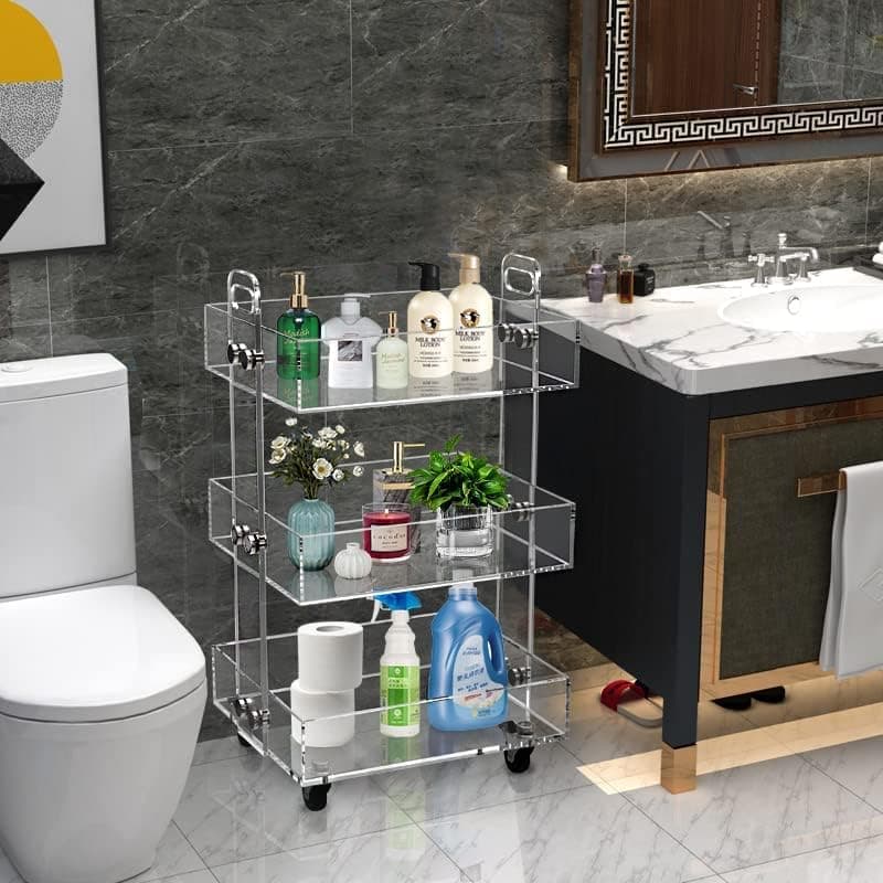 3-tier clear acrylic rolling cart organizing toiletries and plants in a bathroom