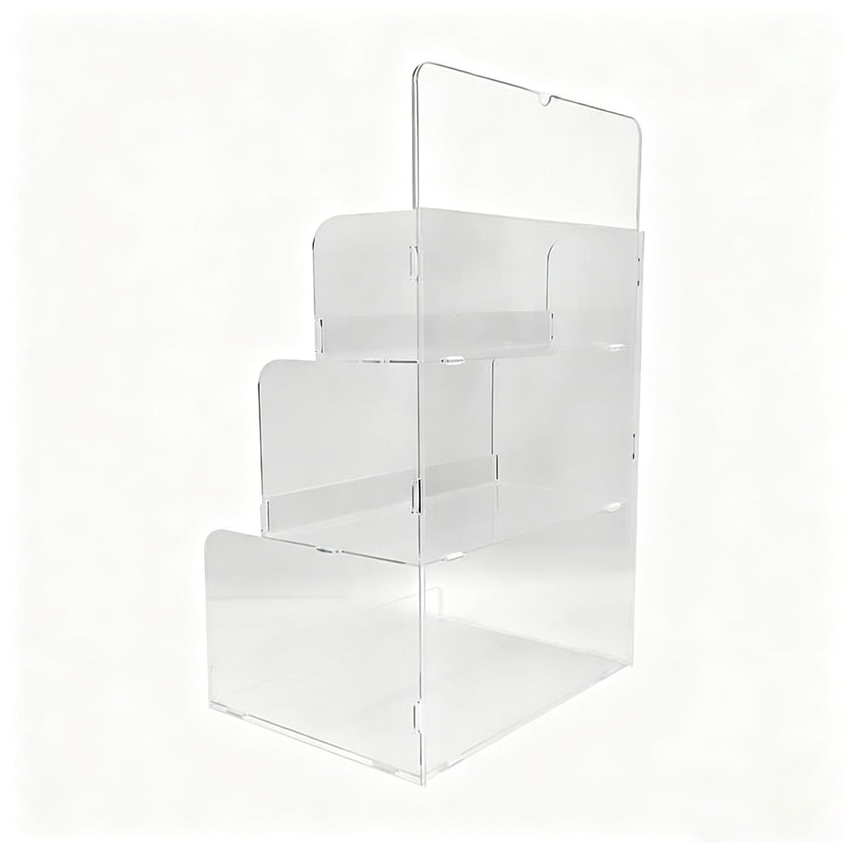 Side view of clear acrylic 3-tier product display rack, showing stepped shelves and header sign mounting structure