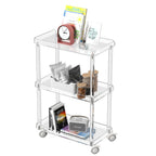 3-tier slim acrylic rolling cart styled in a living room, with a clock, decor, and snacks stored across shelves