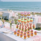 4 tier clear cupcake stand at a beach wedding reception with ocean backdrop