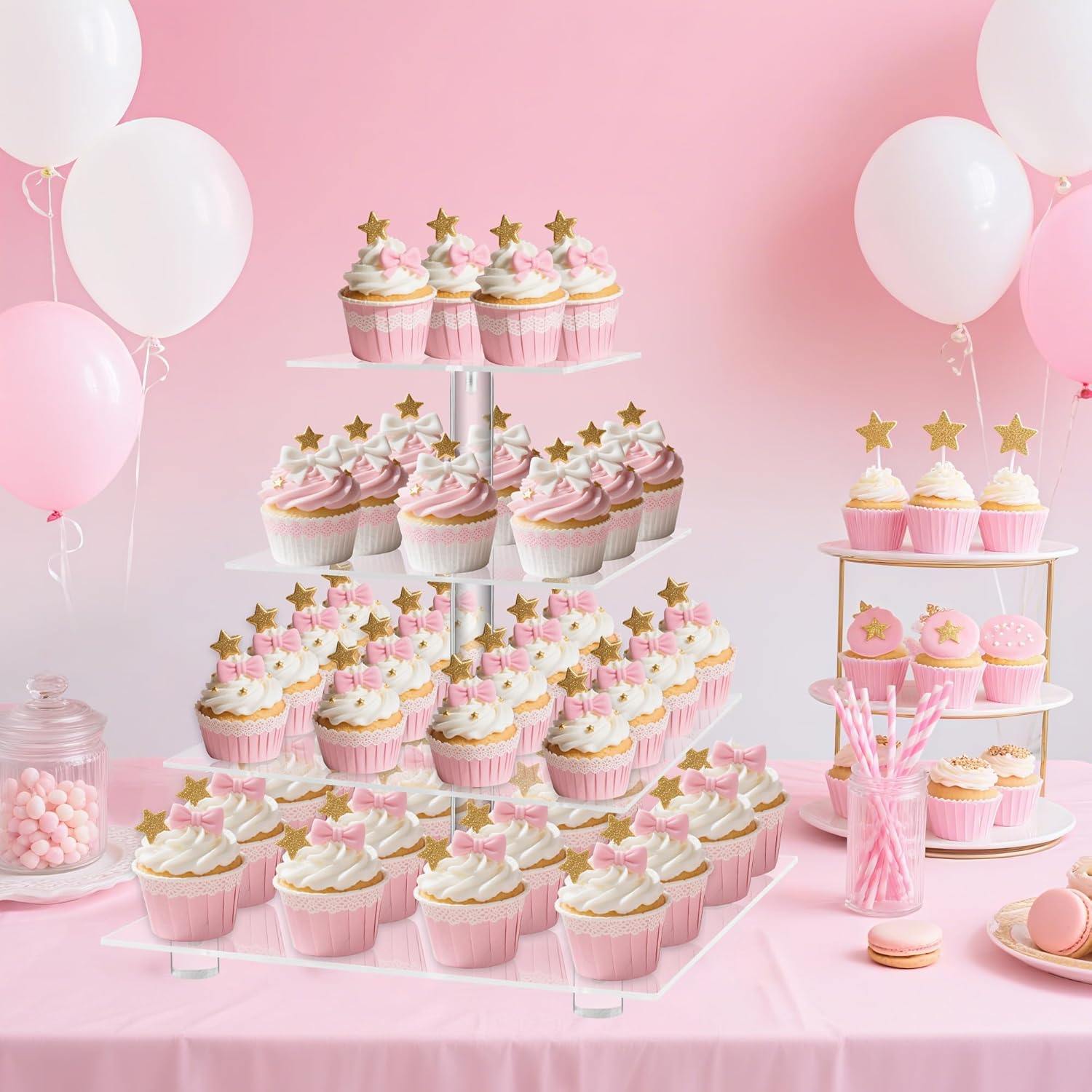 4 tier acrylic cupcake stand at a pink-themed birthday party with balloons
