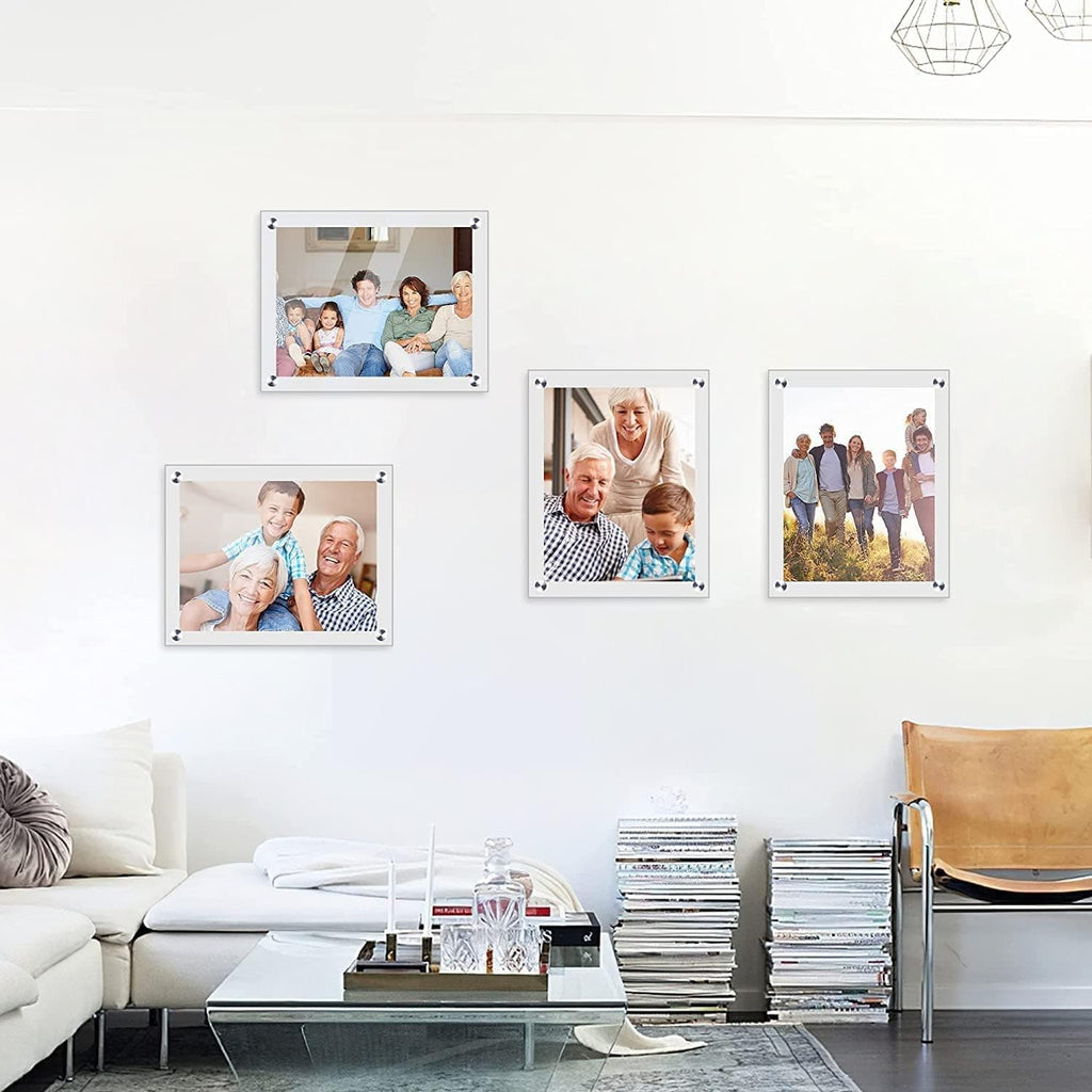 Set of acrylic photo frames arranged as a wall gallery in a living room, displaying family photos. Features high-transparency acrylic material and sleek metal fasteners, suitable for home decor