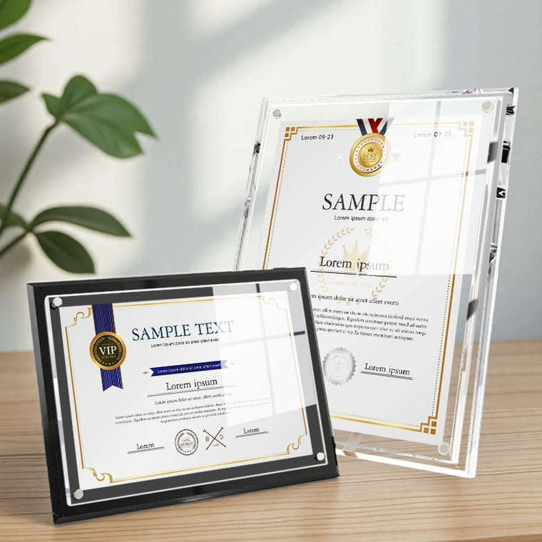 A side-by-side display of two A4-size acrylic certificate frames: a minimalist clear magnetic frame and a sleek black border magnetic frame. Both frames showcase sample certificates, with a modern office background featuring a potted plant, highlighting their professional and stylish presentation for diplomas, awards, and important documents