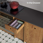 Clear acrylic bag organizer installed in a kitchen drawer for neat storage