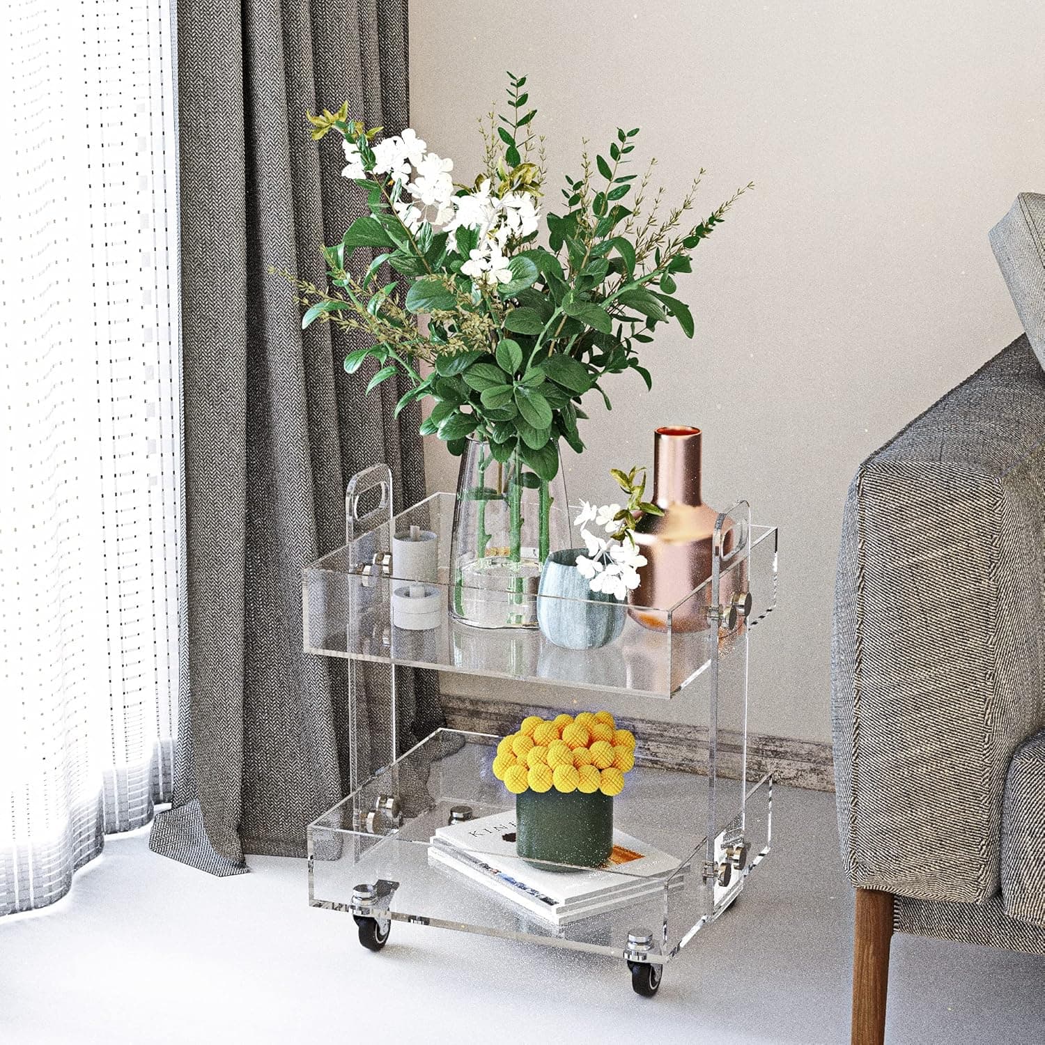 Clear acrylic bar cart styled with flowers and copper barware in a modern living space