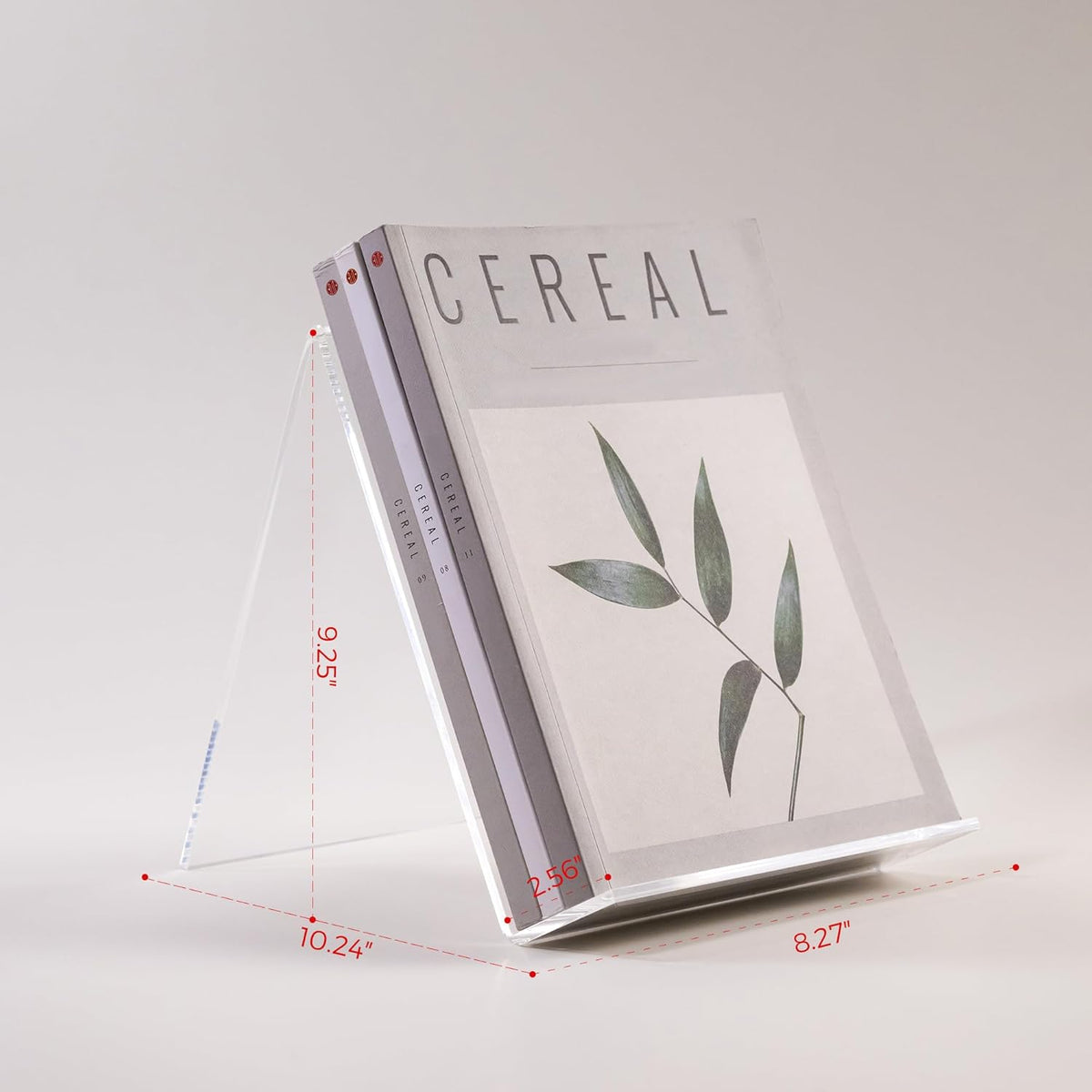 Acrylic book stand displaying 'CEREAL' magazine, modern aesthetic