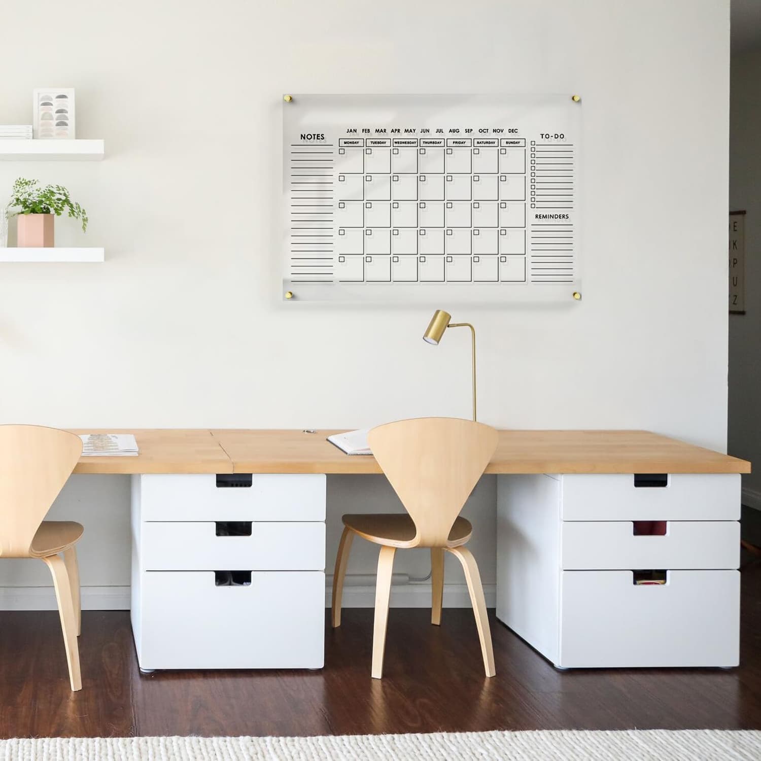 Acrylic wall calendar mounted in a Scandinavian-style home office, blending function and decor