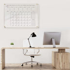 acrylic wall calendar installed in a contemporary office workspace