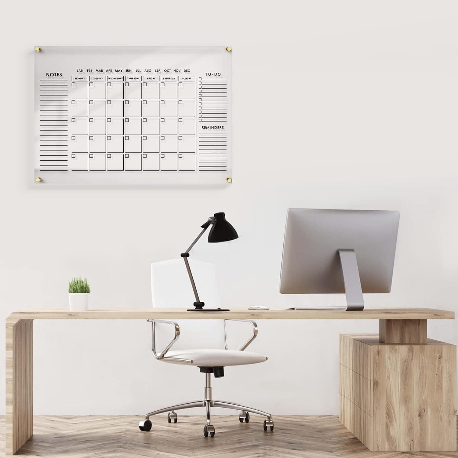 Acrylic planning calendar installed in a modern office workspace, keeping tasks organized