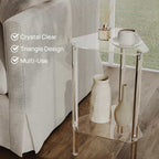 2-tier acrylic corner side table by a sofa, showcasing its crystal clear, triangular design