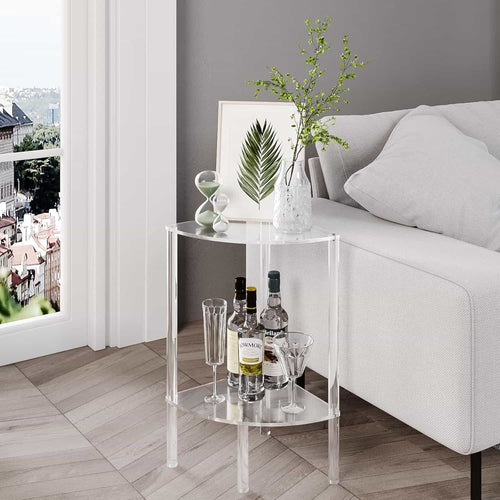 2-tier acrylic corner side table by a sofa, holding a vase of branches, wine bottles, and glasses