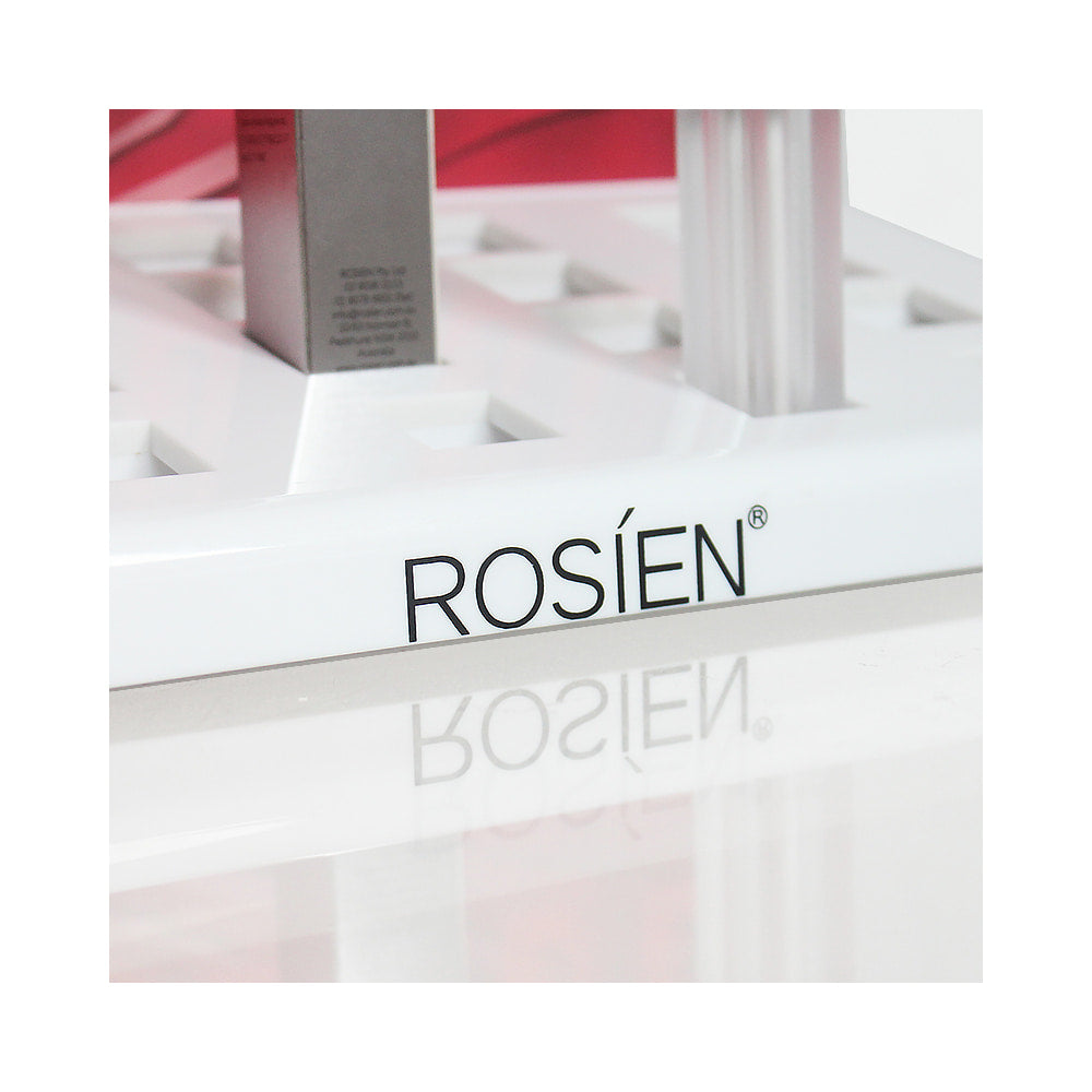 Closeup of custom printed ROSIEN logo on white acrylic cosmetic display stand, UV printing service
