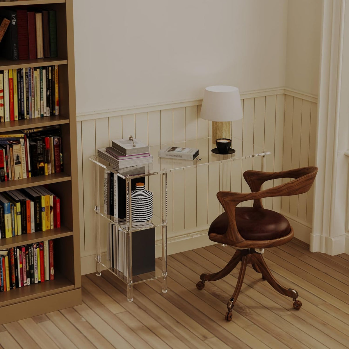 Modern clear acrylic desk with storage shelves in a light home office setting