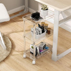 3-tier acrylic cart under a home office desk, organizing books, snacks, and electronics