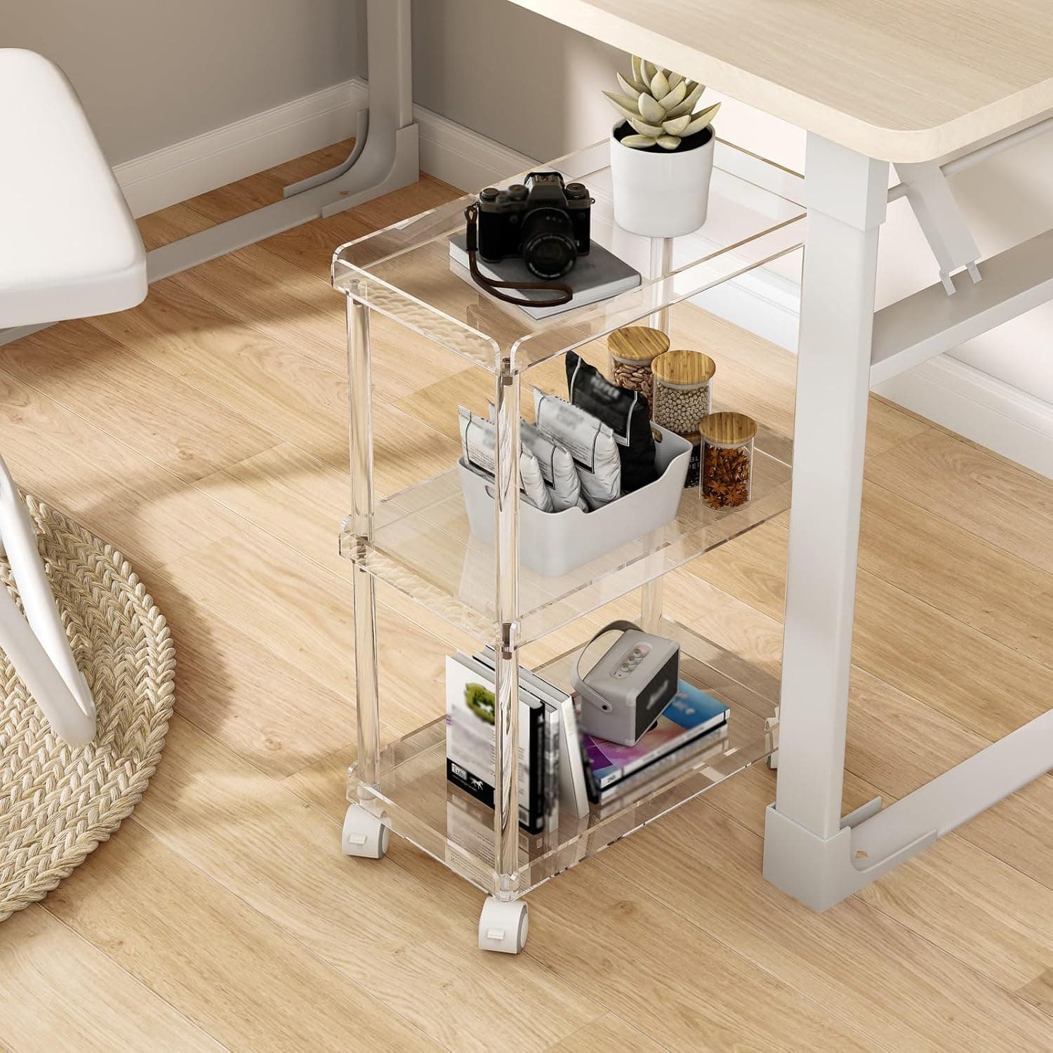 3-tier acrylic cart under a home office desk, organizing books, snacks, and electronics