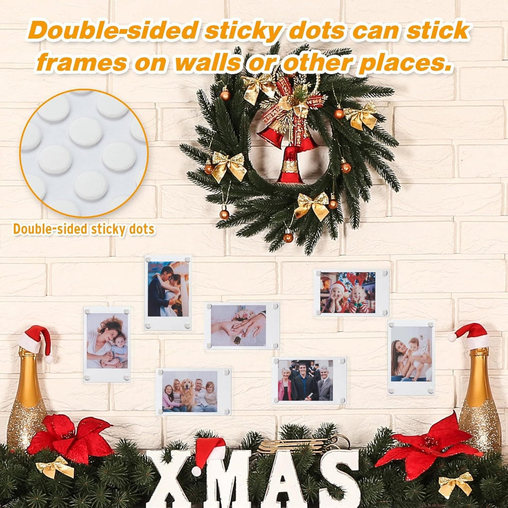 Acrylic photo frames stuck to a wall with double-sided sticky dots, arranged in a festive Christmas display with a wreath and holiday decorations