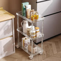 3-tier acrylic storage cart in a kitchen, holding pantry items and a kettle for easy access