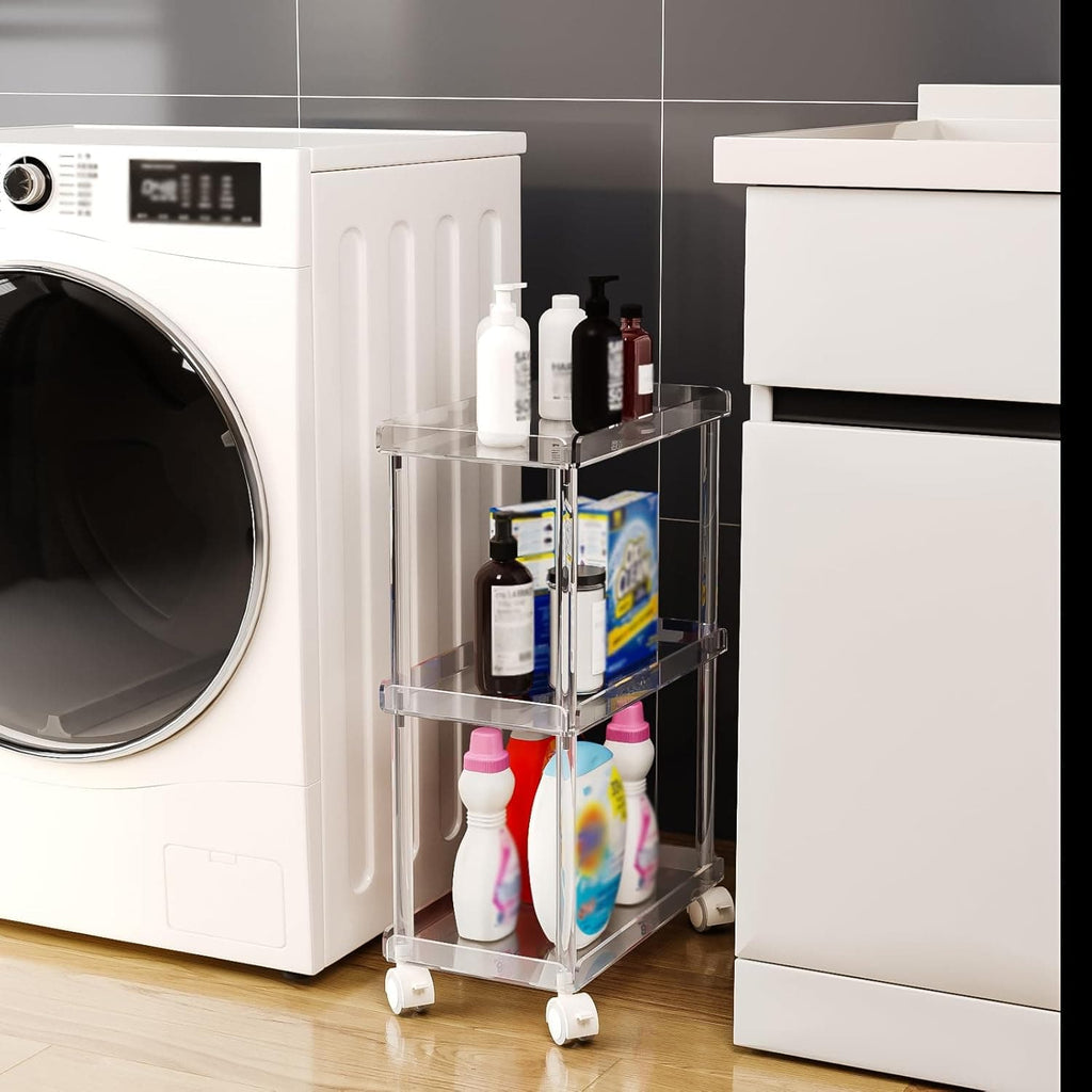 Slim acrylic rolling cart in a laundry room, storing cleaning supplies next to a washing machine