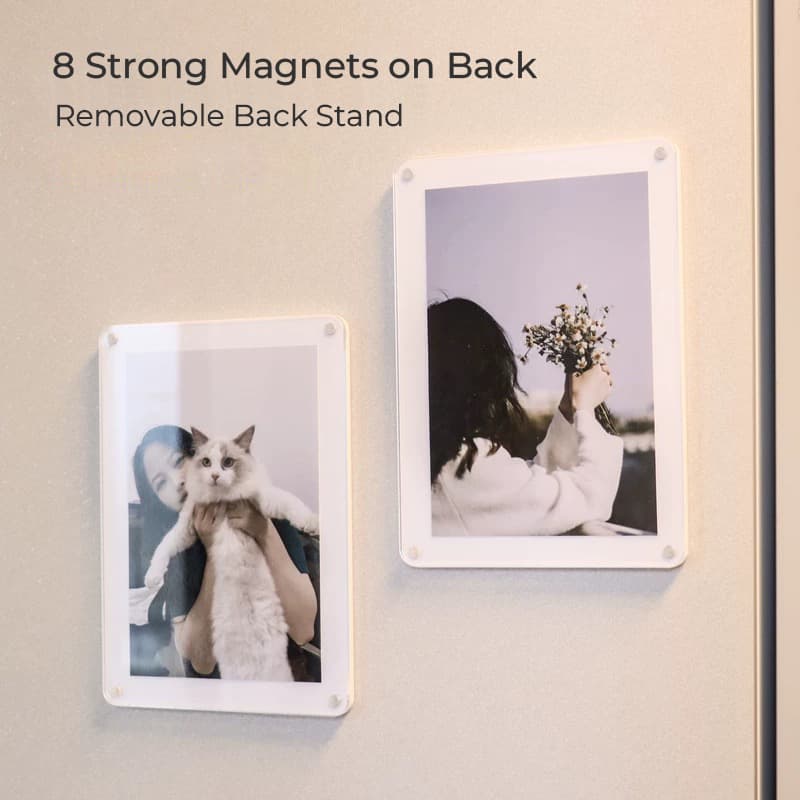 Two acrylic magnetic photo frames mounted on a refrigerator door