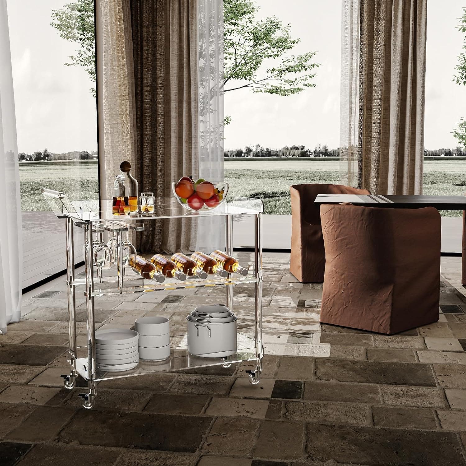 Acrylic serving cart on a patio with a view, holding drinks and tableware for outdoor gatherings