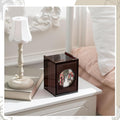 Burgundy acrylic photo storage box displayed on a bedroom nightstand, featuring a circular photo window and elegant decor