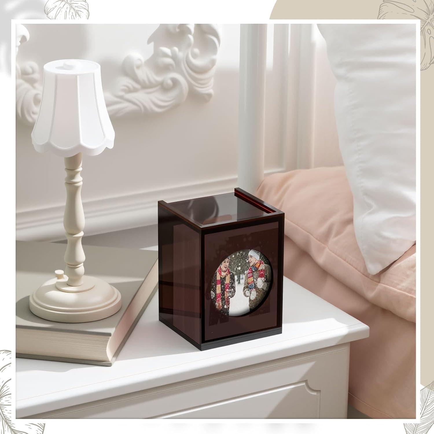 Burgundy acrylic photo storage box displayed on a bedroom nightstand, featuring a circular photo window and elegant decor