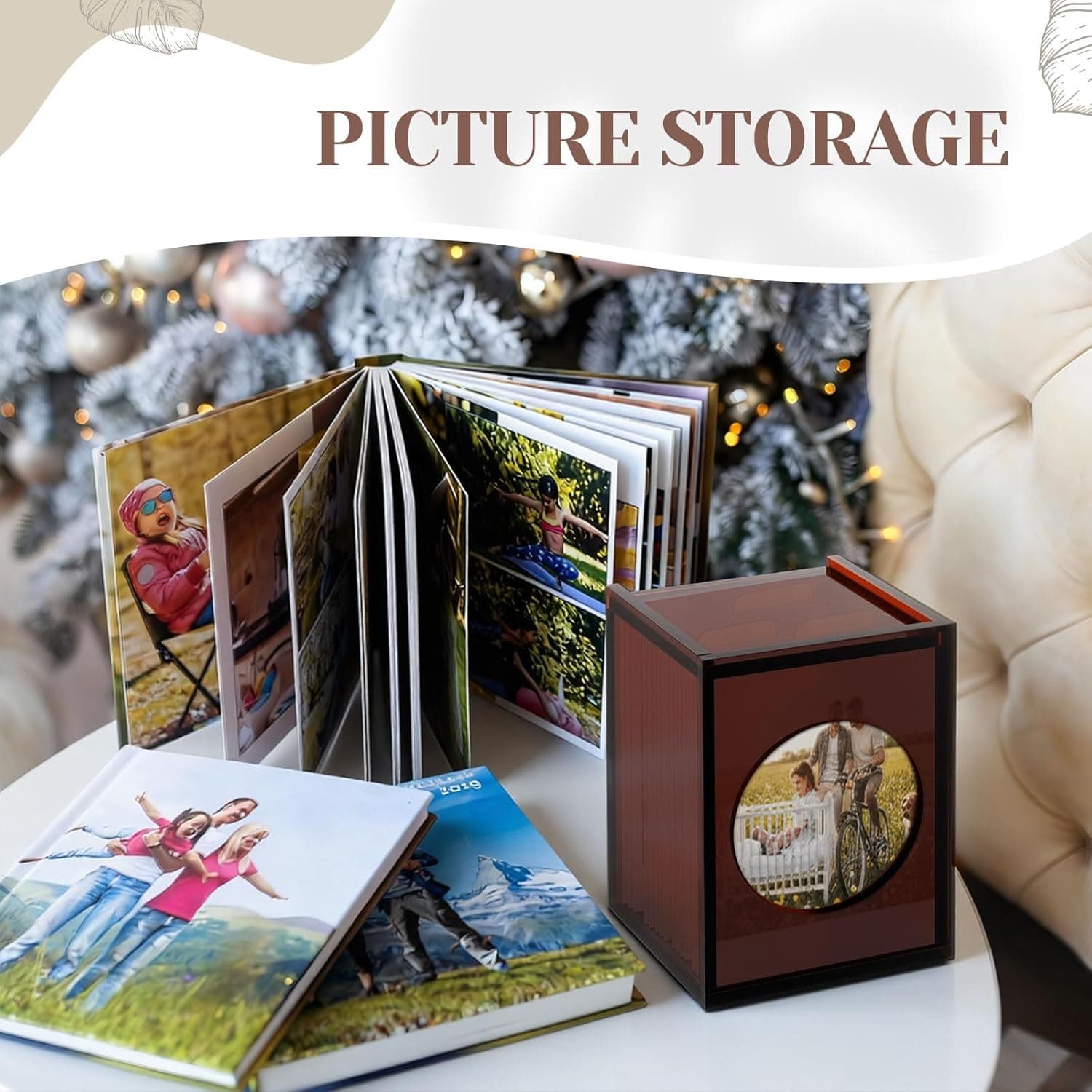 Acrylic photo box next to an expanded photo album, showing its capacity for storing multiple photos or cards