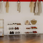 Two acrylic shoe racks (4-tier and 3-tier) in a minimalist closet with hanging clothes and accessories