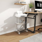 3-tier acrylic rolling stand used under a desk, organizing a printer and stationery items