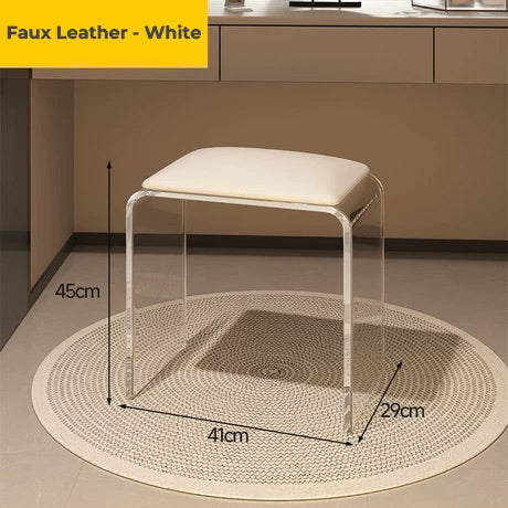 Clear acrylic vanity stool with white faux leather cushion, ideal for makeup nooks