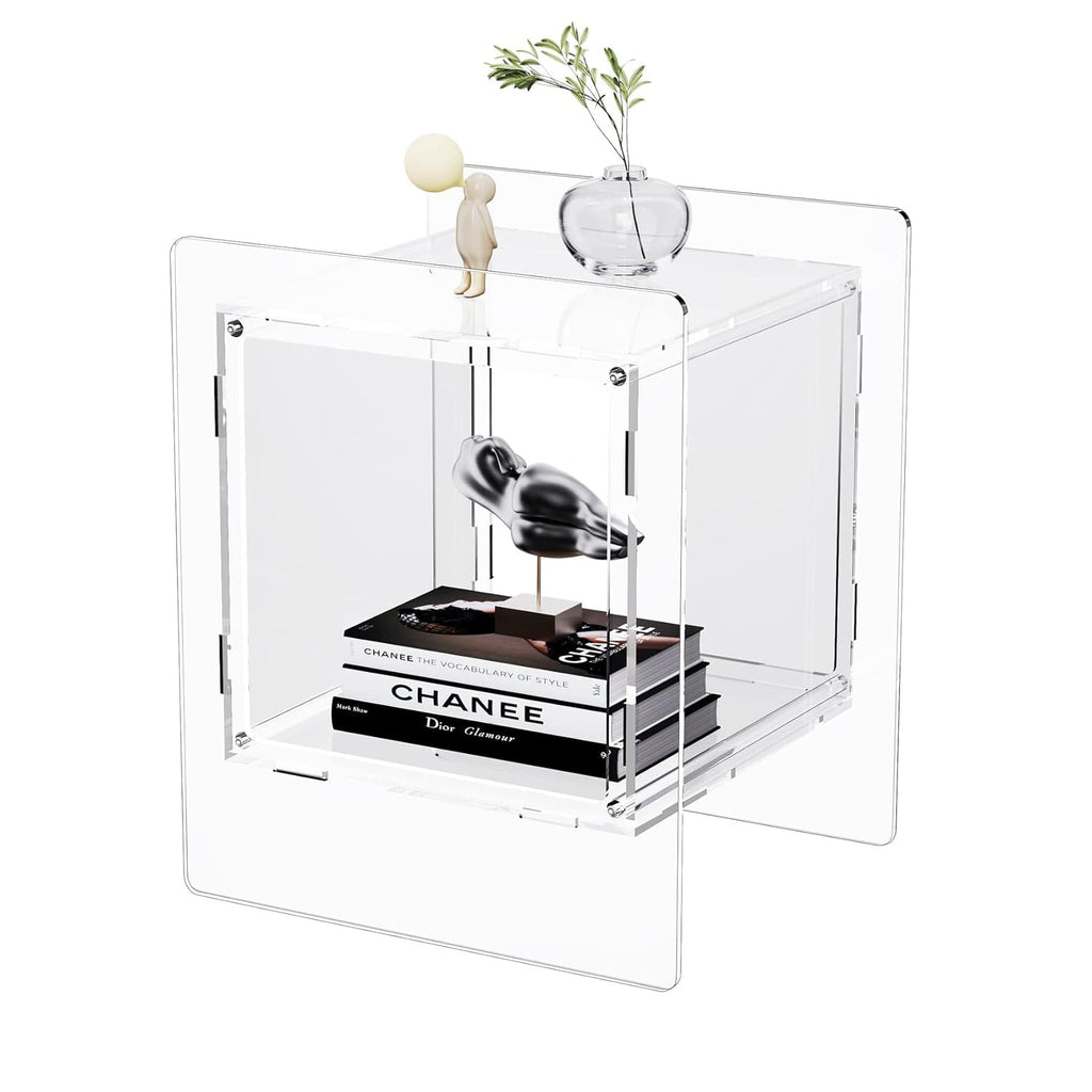 Clear acrylic cube side table with minimalist art decor and a small vase