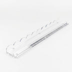 Clear scalloped acrylic mahjong rack with built-in magnetic tile pusher for American mahjong, white background