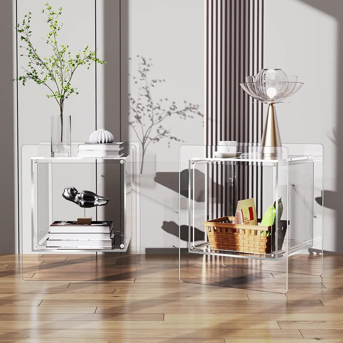 Two clear acrylic cube side tables displayed together, styled with a potted plant and storage basket