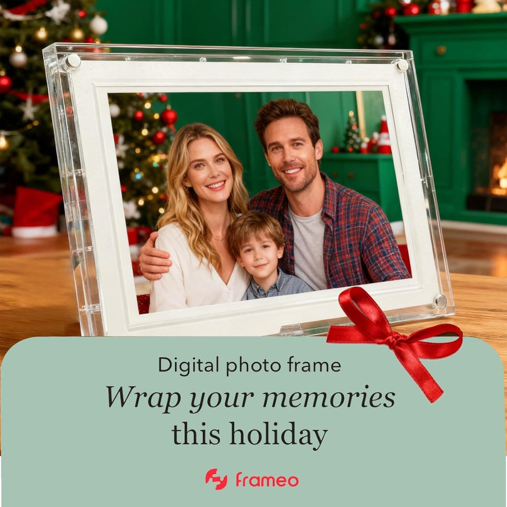 Frameo acrylic digital photo frame decorated with a red ribbon, displayed as a holiday gift for family memories