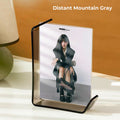 7-inch Distant Mountain Gray acrylic photo frame with black border, displaying portrait photo in home setting