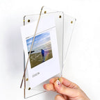 Hand holding disassembled acrylic magnetic photo frame, showing magnet screw assembly, transparent acrylic sheet