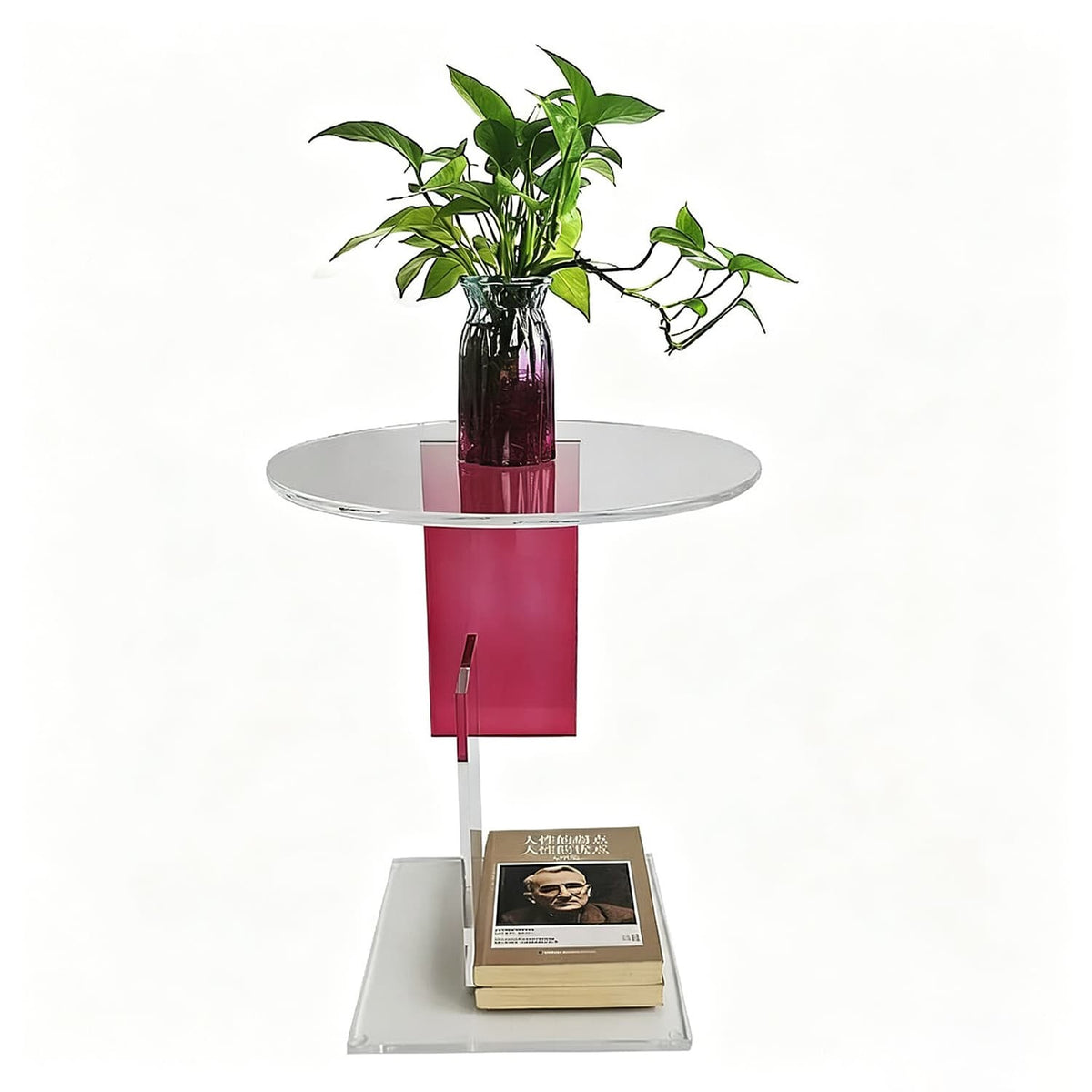 Contemporary acrylic round end table with magenta acrylic support, decorated with glass vase and books, white background