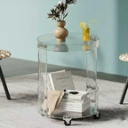 Round acrylic rolling table against a light blue background, featuring a minimalist, transparent design that blends storage and decor