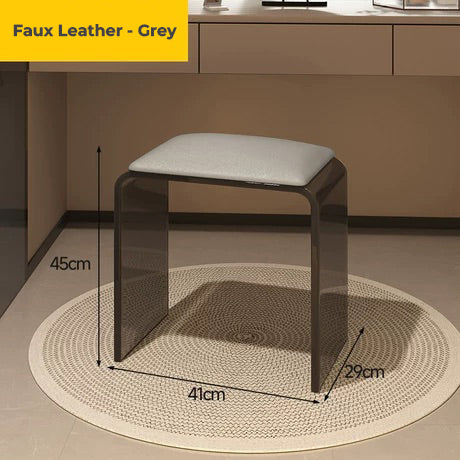 Smoke black acrylic vanity stool with grey faux leather cushion, designed for bathroom use