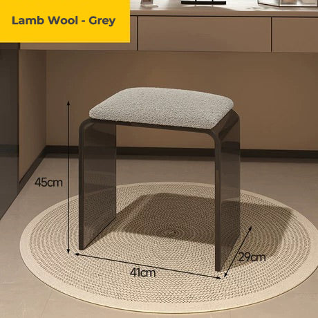 Smoke black acrylic vanity stool with grey lamb wool cushion, highlighting its plush texture
