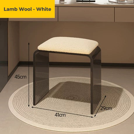 moke black acrylic vanity stool with white lamb wool cushion, showcasing its soft seating