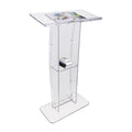 Clear acrylic podium with a slanted desktop, built-in storage shelf holding books, and a wide stable base, ideal for speeches and presentations