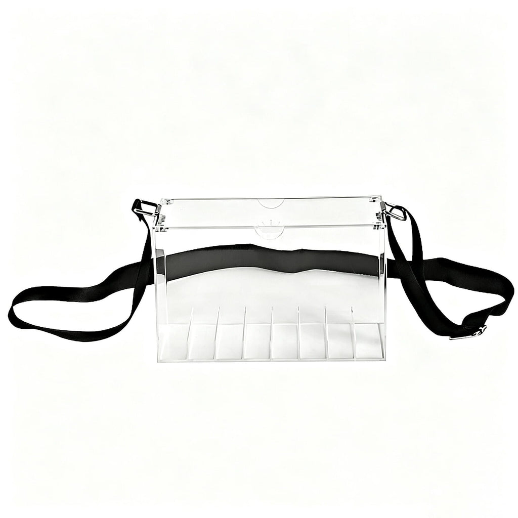 Transparent acrylic carry box with separate compartments and adjustable black strap, retail counter display case on plain white background